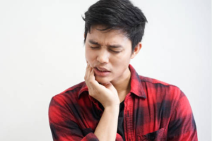 Image of a man having Tooth Pain
